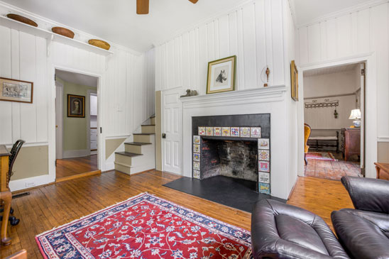 Historic sitting room at 3665 Old River Trail in Powhatan VA with heart pine floors and fireplace