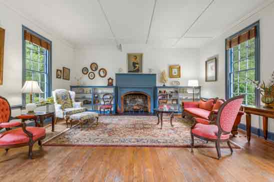 Elegant parlor at Pleasant Oak in Powhatan VA with original heart pine floors and colonial fireplace