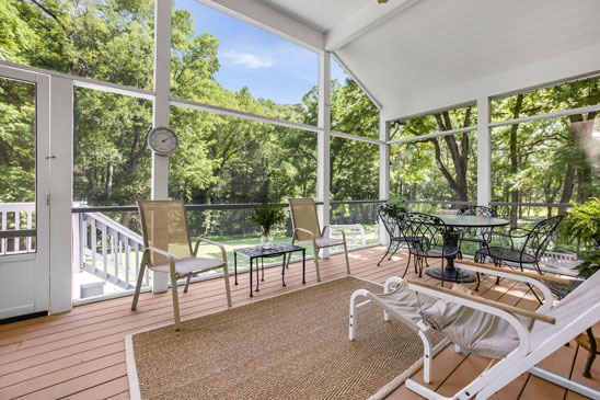 Screened porch at Pleasant Oak in Powhatan VA overlooking trees and private backyard
