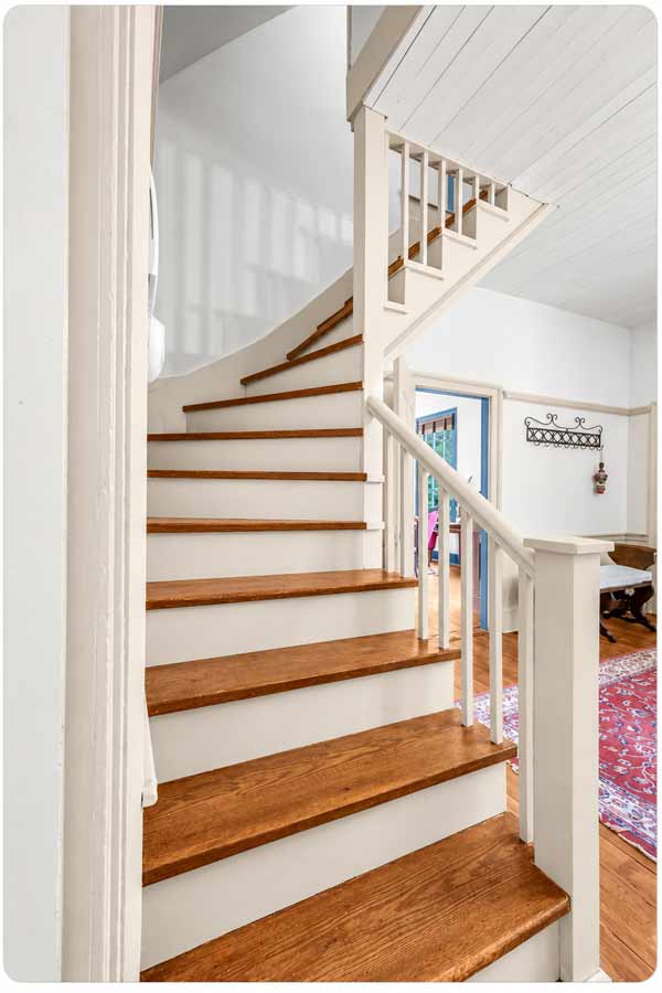 Historic staircase and interior craftsmanship at Pleasant Oak